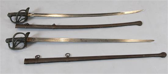 A pair of 19th century French Cavalry swords, length with scabbards 46in.